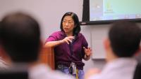 A medical professional teaching a class.